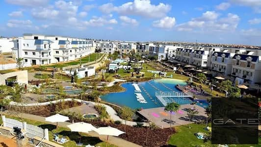 Townhouse in a prime location for sale at a special total price in Chill Out Park Compound - 6th of October, with a landscape view.