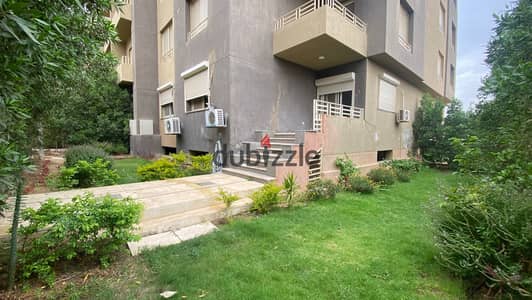 Semi-furnished apartment with a garden for rent in Katameya Gardens.