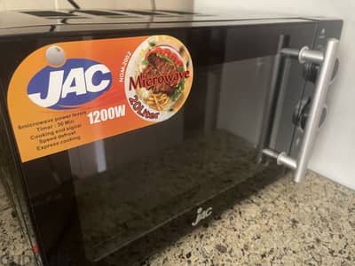 New JAC microwave with 1000 less ( selling for traveling)