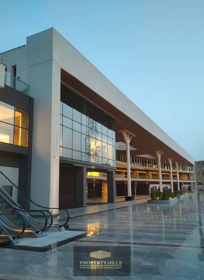 Office for immediate sale, 200 meters, prime location on 26th of July Axis, fully equipped with all facilities, next to Mall of Arabia and Hyper One