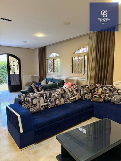 Apartment with private garden, immediate occupancy, fully finished to an ultra-super-lux standard - open view - New Cairo - directly on Sadat Axis