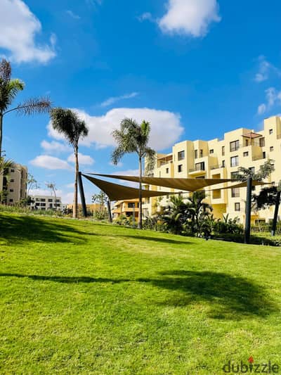 Luxury apartment for sale, fully finished, in O West Compound by Orascom, in a prime location with near-term occupancy and installment payment options