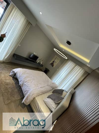 For sale at the lowest price: 123 sq m apartment, resale, installments remaining, finished with air conditioning, Village West, Sheikh Zayed