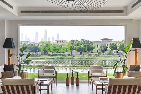 Fully finished apartment with a direct view of landscaped green areas.