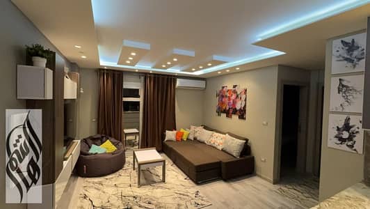 Apartment for sale in Madinaty, super luxury finishing, kitchen included, open view of The Spine, next to Third Park and services.