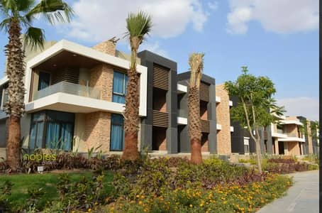 Ready to move, Fully finished with air conditioning, overlooking a garden in prime location in Midtown Villa New Capital City