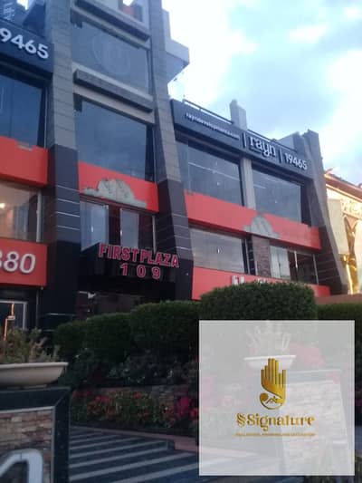 For administrative or commercial rent: a large office with a super deluxe finish, located on Banks Street, Fifth Settlement, with a view of a main str