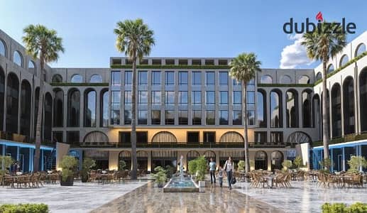 An office space of 34m² for sale at Majan Mall, Zewail Road, opposite Zewail City, 10% down payment, and flexible installment options up to 9 years.