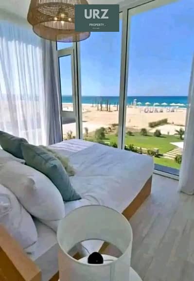شاليه فاخر جدا رؤيه واضحه للبحر و اللاجون كامل التشطيب High End بالتكيفات للبيع فى أفضل موقع بالساحل الشمالى بجوار  وترواى دوس مدن سولت