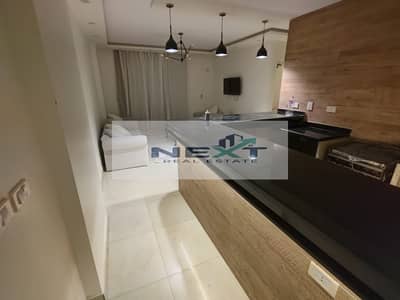 For rent in Madinaty, a furnished apartment, 77 sq m, ground floor, high-end finishing, 2 bedrooms + 1 bathroom, elegant furnishings, open view, one m