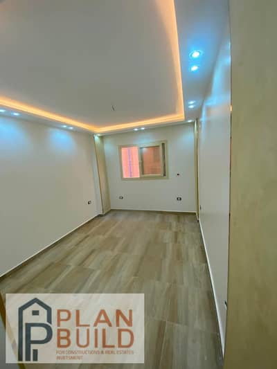 Apartment for sale in Investment Buildings, Al-Firdaws City, 150 meters, two bedrooms, two bathrooms, kitchen, and reception, ultra super deluxe finishing, and northern balcony.