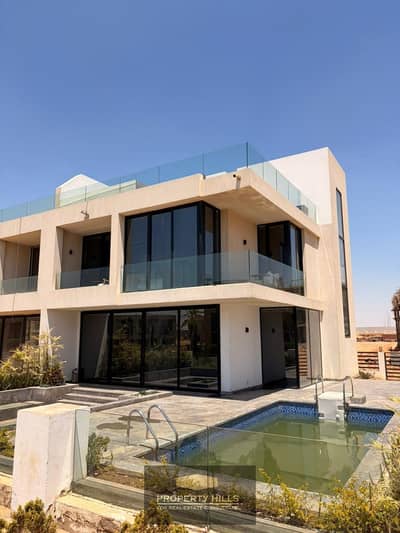 Receive immediately an independent villa with a swimming pool view of the lakes next to Chill Out Park and Grand Heights near Zayed 5