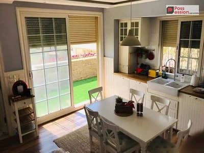 Apartment for sale, ground floor with a garden and private entrance in Taj City Compound in front of Cairo Airport, on the Ring Road,  115m+ 20 m