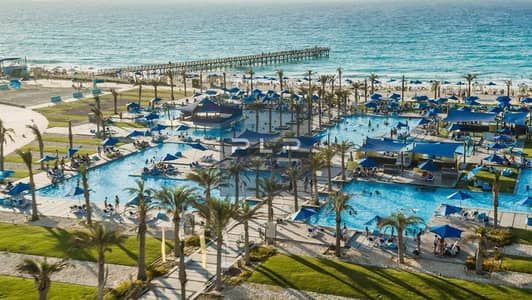 The most distinguished and best twin apartment for sale in La Vista Bay East, with a sea view and a prime location overlooking two swimming pools.