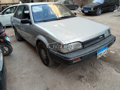 مازدا 323 1990 للبيع التجمع الاول