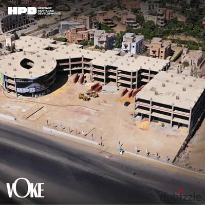 For sale: a commercial shop directly on Sadat Axis, Fifth Settlement, on the wall of Al Nakheel Resort, ground floor, ready for inspection, with insta