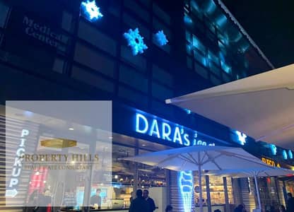 A shop for immediate occupancy, currently rented with a high monthly return of 300,000 in the Golden Square area of ​​Fifth Settlement. Installment plans are available for the price over an extended period.