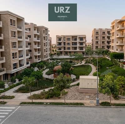 2-bedroom apartment for sale in Center Park, New Cairo. Installments up to 12 years or 50% cash discount. Prime location on Suez Road near AUC