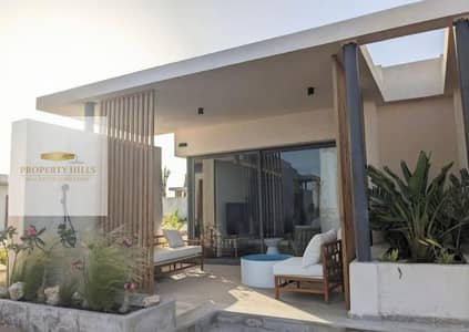 Fully finished cabin for sale in installments in the heart of the North Coast in Gaia Sabbour - Gaia Sabbour at kilometer 194, walled with Swan Lake