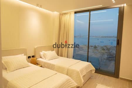 fully finished and fully furnished with ac's and kitchen appliances town house direct on marina for sale in Marina 5 North Coast.