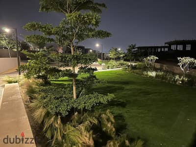 Spacious apartment with a private garden in Swan Lake Compound - Hassan Allam, featuring luxurious finishes and a prime location near Arkan and Cairo