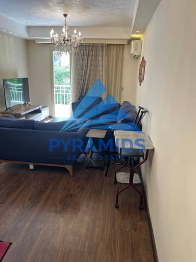 Available for sale in Madinaty: a hotel-style apartment with special finishes, first floor, wide garden view.