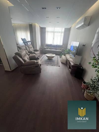 In New Cairo, a fully finished 3-bedroom apartment with air conditioning is for sale with a 25% discount in 90 Avenue Compound, behind the American Un