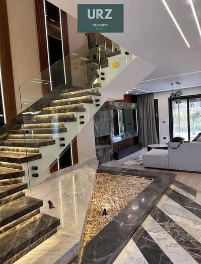 Fully finished villa with an open view in a prime location on Suez Road and Ismailia Desert Road near La Vista and Al Burouj Flexible installments o
