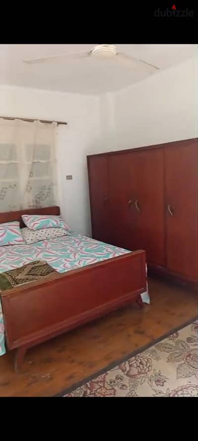 Two-bedroom apartment for rent in downtown with an open view of Abdel Moneim Riad Square