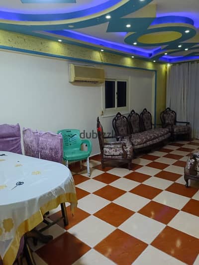 Furnished apartment 120 m the air-conditioned lounge for annual rent family or groom or company 3 bedrooms reception two pieces kitchen bathroom fifth floor upper there are all facilities water and electricity and elevator in Alexandria Al-Ajami kilo 21 beach of palm street 27 main in a very distinguished location