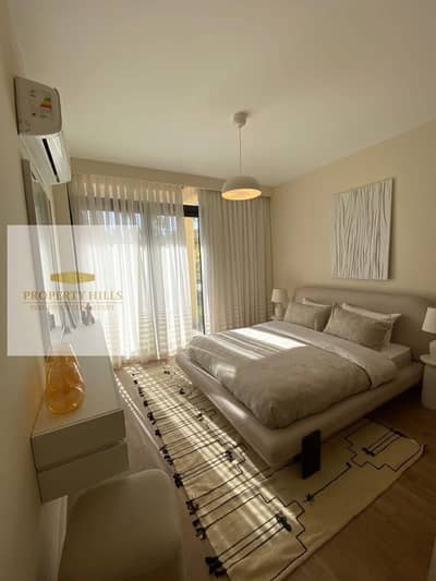 Apartment for sale in installments in Taj City Compound, opposite Cairo International Airport and minutes from Heliopolis.