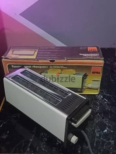 توستر toaster الماني جديد بعلبته  بيسخن الخبز المجمد في حدود دقيقه