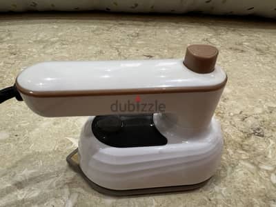Portable small iron. Doesn't get too hot. For lightweight fabrics.