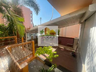 For sale in Al-Rehab, a ground floor apartment with a private garden and very special finishes, fully furnished