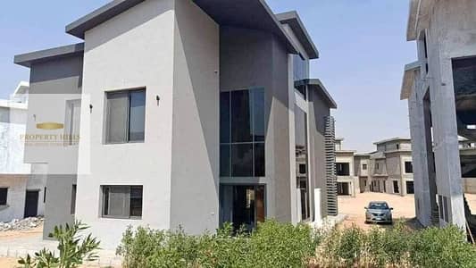 Last villa dropped in price with an open view on water features from Al-Khadar in Creek Town Compound directly on Suez Road in the Fifth Settlement