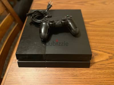 Used PlayStation 4 with controller