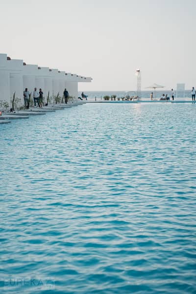 Own a two-bedroom apartment with panoramic ocean views at Direction White, located near Ras Al-Hikma, next to John, Cali Coast, and Hacienda Waters