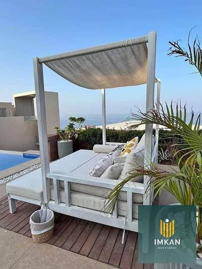 3-bedroom chalet, ready for immediate occupancy, fully finished with air conditioning, in Sodic John Ras El Hekma, close to the sea, with a lagoon vie