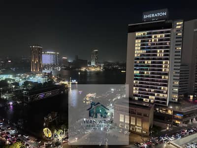 للصفوة وعشاق الفخامة شقة بانوراما ساحرة اول صف "أمام الشيراتون وعلي النيل مباشرة" بميدان الجلاء For the elite and lovers of luxury, a charming panoram