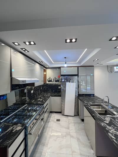 A ground floor apartment with a garden for rent in Azad Compound, including kitchen, air conditioning and kitchen appliances at a bargain price A ground floor apartment with a garden for rent in Azad Compound, including kitchen, air conditioning and kitchen appliances at a bargain price