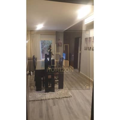 lowest price furnished studio with garden for sale in Compound The Village Palm Hills New Cairo