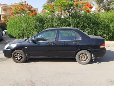 ميتسوبيشي لانسر 2007 بومة