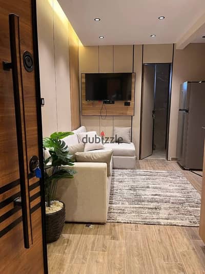 Studio for sale in 6 October, Neighborhood 1, Area 8, fully furnished with hotel-style furnishings, guaranteed return next to Msa