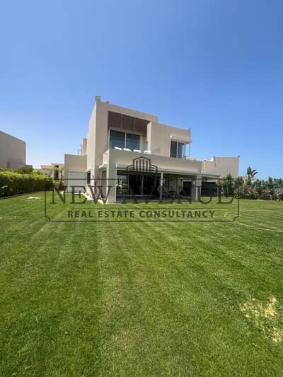 Luxury villa for sale in one of the finest locations in Hacienda Bay North Coast, featuring direct golf and lagoon views, premium finishing, and a gre