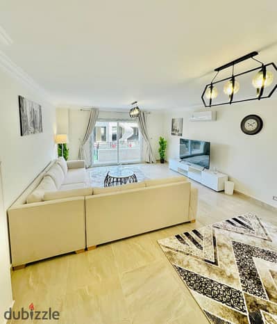 For rent furnished – Zayed Regency Compound | Sheikh Zayed Ground floor apartment with garden featuring elegant modern finishes 2 bedrooms 2 bathrooms private garden smart screen Wi-Fi available for daily and monthly rental prime location inside Zayed Regency Compound – Sheikh Zayed