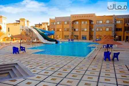 110 sqm chalet corner for sale in Ain Sokhna, ground floor with private garden and direct sea view at a special price.