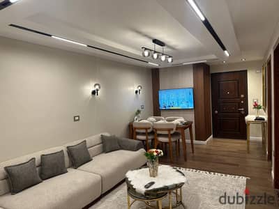 Furnished hotel apartment with hotel-style finishing for rent, first occupancy, near the Sheraton Hotel in Dokki, for upscale and distinguished accommodation.