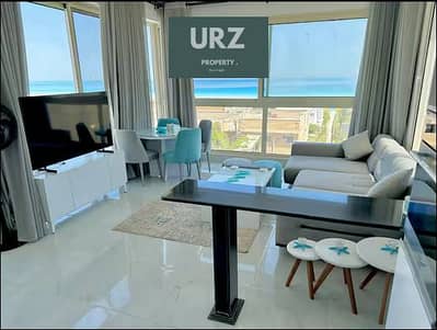 Beachfront chalet just 200m from the sea in the North Coast  fully finished with kitchen and ACs  Flexible installment plans Prime location near New