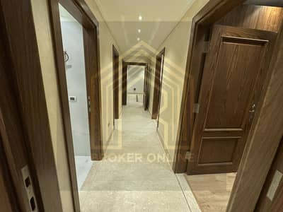 For rent, a ground floor apartment with a garden in Hadayek October [Beta Greens Compound] with kitchen and air conditioning