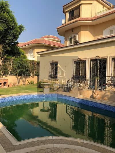 Standalone Villa for Sale – Mina Garden City – Sheikh Zayed  A spacious standalone villa for sale in Mina Garden City featuring a private swimming pool and practical family layout